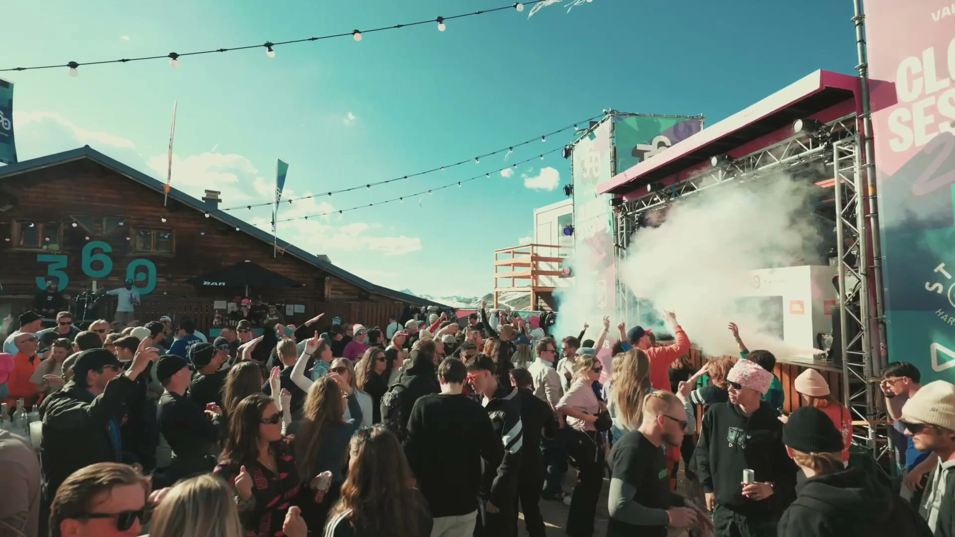 Crowd dancing in front of the Stëlz stage at a ski festival