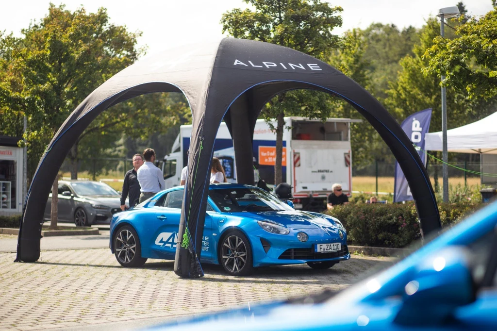 Black Airdome over a blue sports car