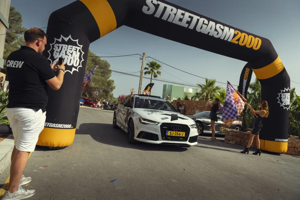 Branded inflatable arch over the start of a car rally