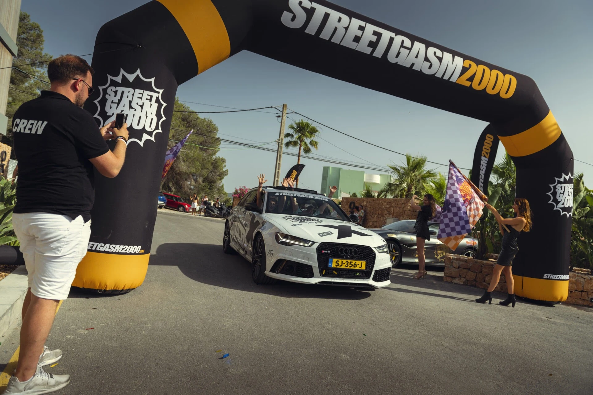 Branded inflatable arch over the start of a car rally